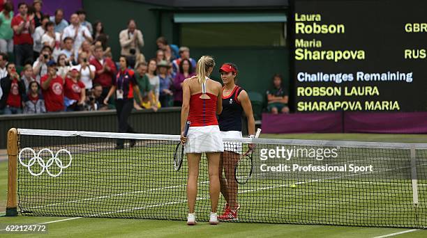 Laura Robson of Great Britain congratulates the victorious Maria Sharapova of Russia at the conclusion of their Women's Singles Tennis match on Day 4...
