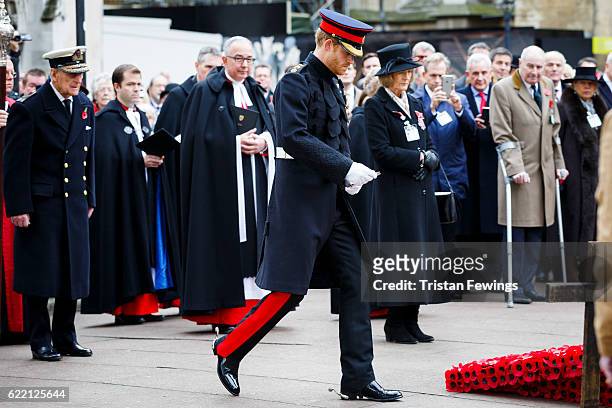 Prince Harry lays a cross at the Fields of Remembrance at Westminster Abbey on November 10, 2016 in London, England.