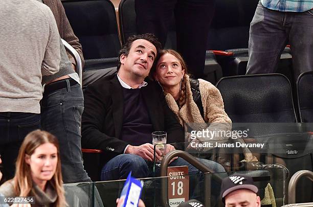 Olivier Sarkozy and Mary-Kate Olsen attend New York Knicks vs Brooklyn Nets game at Madison Square Garden on November 9, 2016 in New York City.