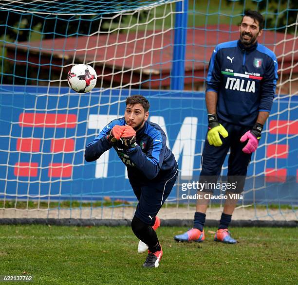 Gianluigi Donnarumma and Gianluigi Buffon in action during the training session at the club's training ground at Coverciano on November 10, 2016 in...