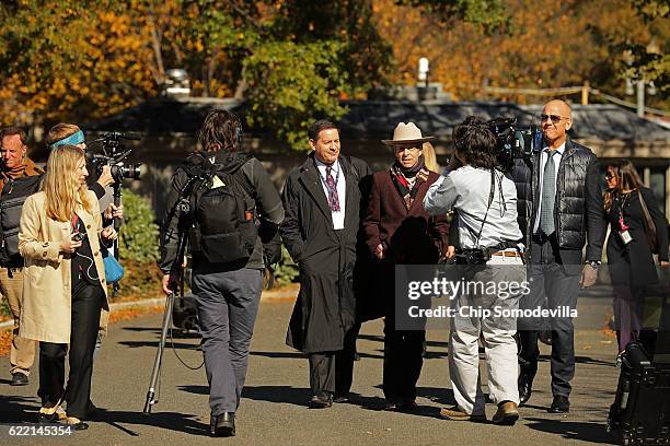 Mark Halperin, Mark McKinnon and John Heilemann of the television program "The Circus" walk down the driveway in front of the West Wing ahead of the...