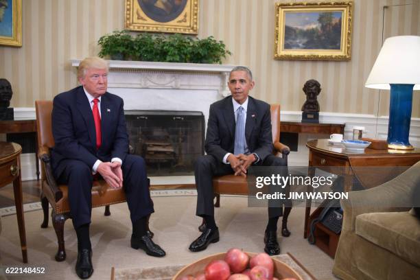 President Barack Obama meets with President-elect Donald Trump to update him on transition planning in the Oval Office at the White House on November...