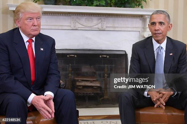 President Barack Obama meets with President-elect Donald Trump to update him on transition planning in the Oval Office at the White House on November...