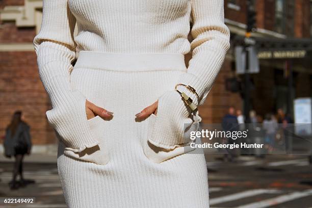 Ana Sousa wearing Ecru white ribbed knit sweater with polo neck and long sleeves with slit from Zara, white midi high waisted Ecru ribbed knit pencil...