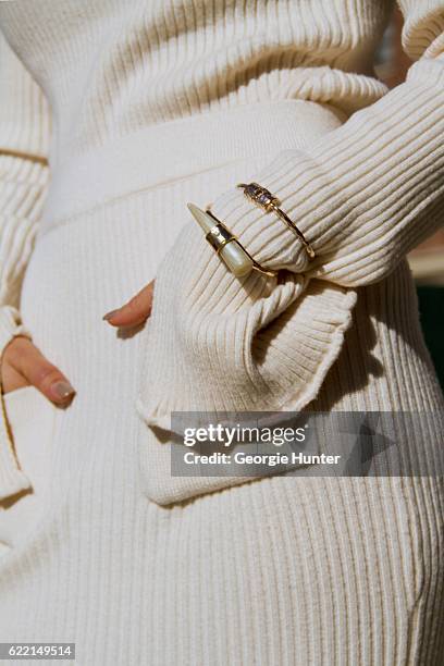 Ana Sousa wearing Ecru white ribbed knit sweater with polo neck and long sleeves with slit from Zara, white midi high waisted Ecru ribbed knit pencil...