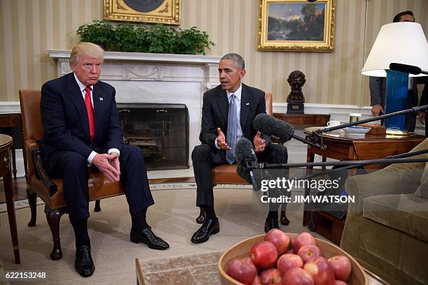 President Barack Obama meets with Republican President-elect Donald Trump to update him on transition planning in the Oval Office at the White House...