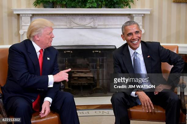 President Barack Obama meets with President-elect Donald Trump in the Oval Office at the White House on November 10, 2016 in Washington, DC. / AFP /...