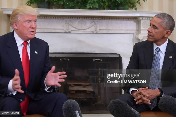 President Barack Obama meets with Republican President-elect Donald Trump in the Oval Office at the White House on November 10, 2016 in Washington,...
