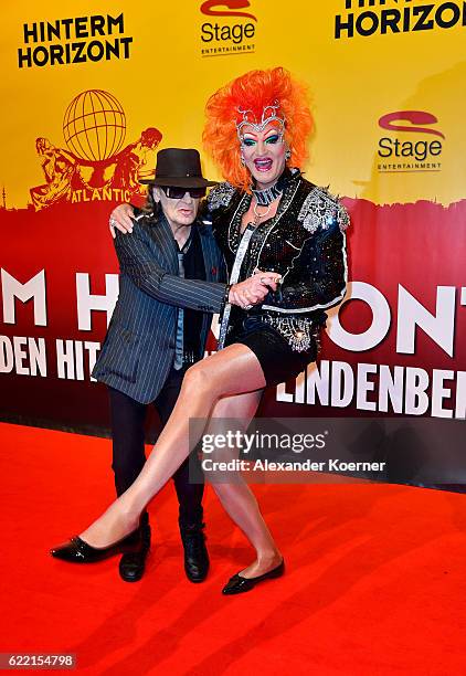 Udo Lindenberg and Olivia Jones attend the red carpet at the Hinterm Horizont Musical premiere at Stage Operretenhaus on November 10, 2016 in...