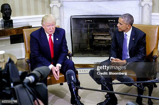 President Barack Obama, right, listens as U.S. President-elect Donald Trump speaks during a news conference in the Oval Office of the White House in...