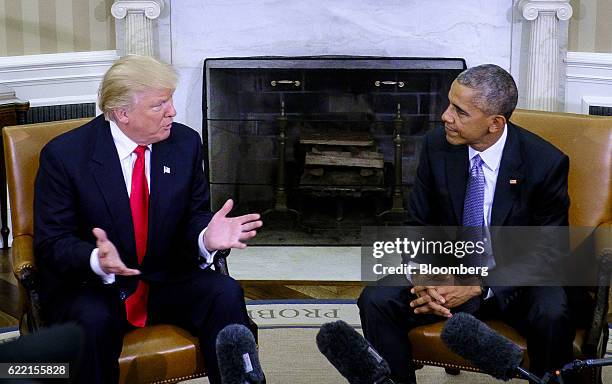 President Barack Obama, right, listens as U.S. President-elect Donald Trump speaks during a news conference in the Oval Office of the White House in...