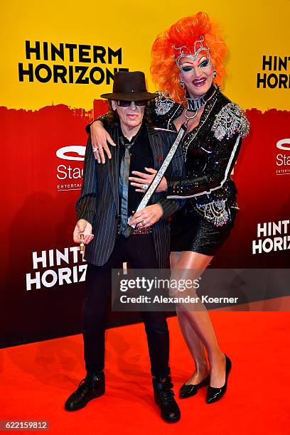 Udo Lindenberg and Olivia Jones attend the red carpet at the Hinterm Horizont Musical premiere at Stage Operretenhaus on November 10, 2016 in...