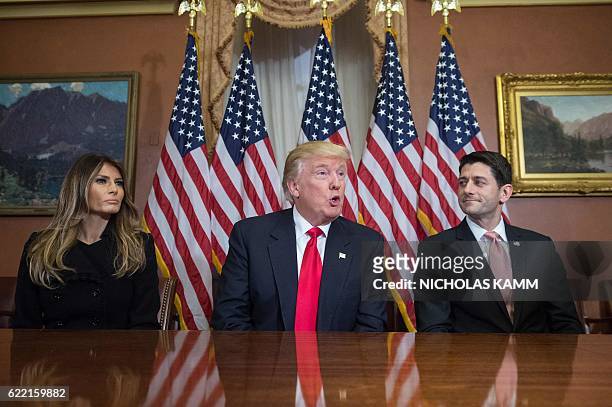 President-elect Donald Trump speaks to the press with his wife Melania and House Speaker Paul Ryan at the US Capitol in Washington, DC, on November...