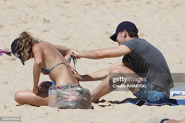 Demi Harman pictured with partner Alec Snow enjoying a beach outing on October 15, 2016 in Sydney, Australia.