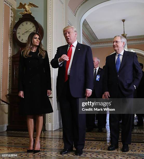 President-elect Donald Trump talks to the media while joined by his wife Melania Trump, and Senate Majority Leader Mitch McConnell after a meeting at...