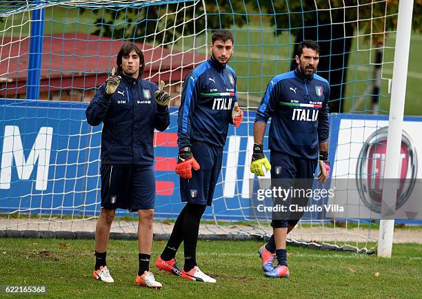 Mattia Perin, Gianluigi Donnarumma and Gianluigi Buffon look on during the training session at the club's training ground at Coverciano on November...