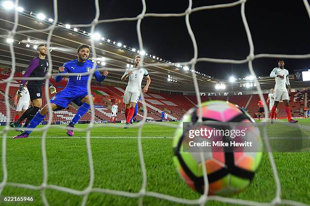 Federico Di Francesco of Italy celebrates as a deflected own goal from Brendan Galloway of England loops over goalkeeper Angus Gunn into the England...