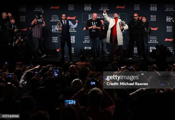 Lightweight champion Eddie Alvarez and UFC featherweight champion Conor McGregor of Ireland square up for a photo during the UFC 205 press conference...