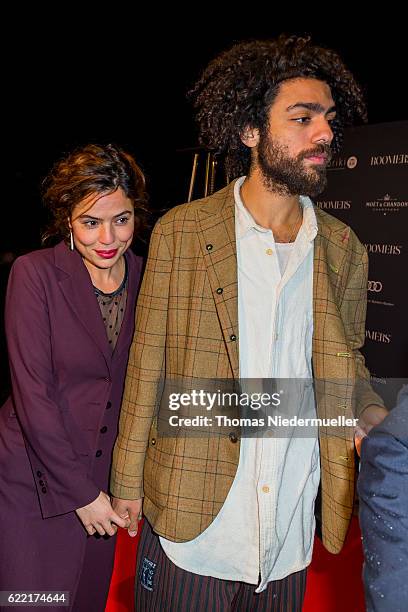 Noah Becker and Taina Moreno de Oliveira Lagoeiro attend the red carpet during the grand opening of Roomers hotel on November 10, 2016 in...