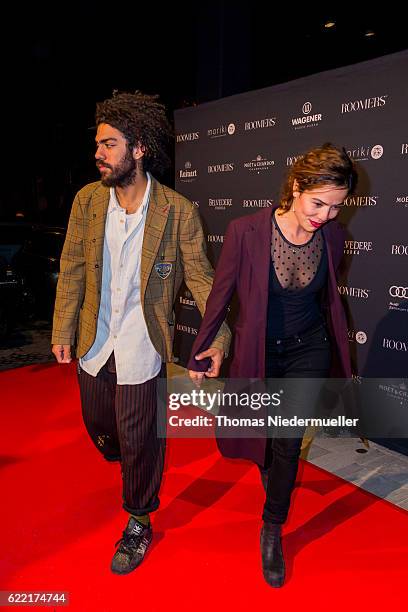 Noah Becker and Taina Moreno de Oliveira Lagoeiro attend the red carpet during the grand opening of Roomers hotel on November 10, 2016 in...