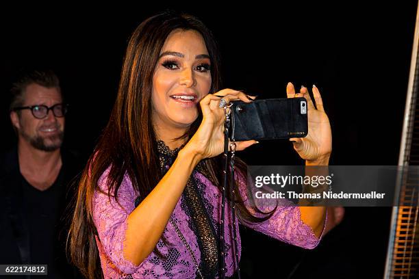 Verona Pooth take pictures at the red carpet during the grand opening of Roomers hotel on November 10, 2016 in Baden-Baden, Germany.