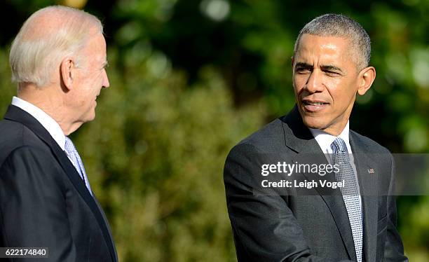 President Obama speaks with Vice President Biden as he welcomes the 2016 NBA Champions Cleveland Cavaliers to The White House on November 10, 2016 in...