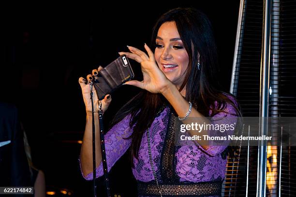 Verona Pooth take pictures at the red carpet during the grand opening of Roomers hotel on November 10, 2016 in Baden-Baden, Germany.