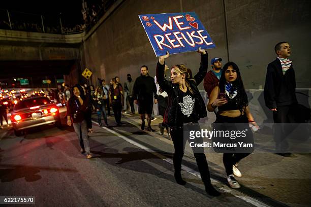 Anti-Trump protesters walk out of the 101 freeway in Los Angeles, Calif., on Nov. 10, 2016.