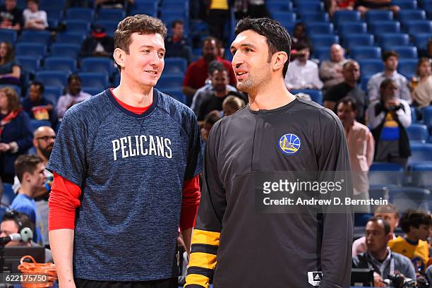 Omer Asik of the New Orleans Pelicans and Zaza Pachulia of the Golden State Warriors talk before a game at Smoothie King Center on October 28, 2016...