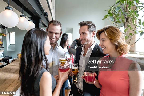 people having drinks at a restaurant - business party stockfoto's en -beelden