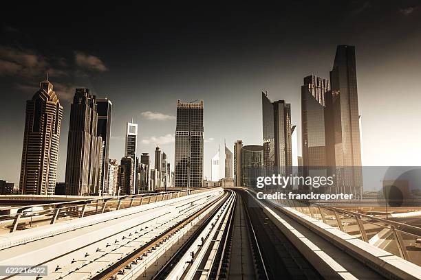 dubai skyline with downtown on the metro - emirates towers stock pictures, royalty-free photos & images