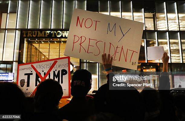 Dozens of anti-Donald Trump protesters stand along 5th Avenue in front of Trump Tower as New Yorkers react for a second night to the election of...