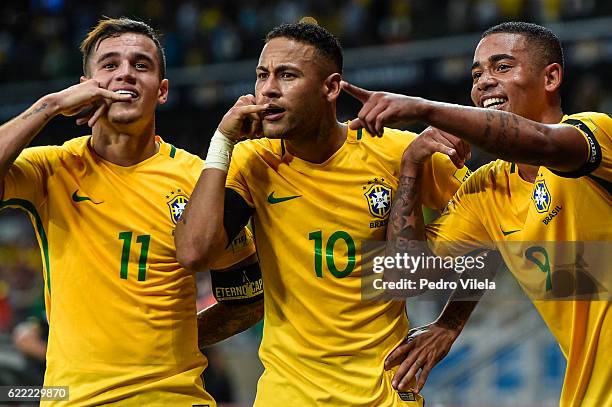 Philippe Coutinho, Neymar and Gabriel Jesus of Brazil celebrates a scored goal against Argentina during a match between Brazil and Argentina as part...