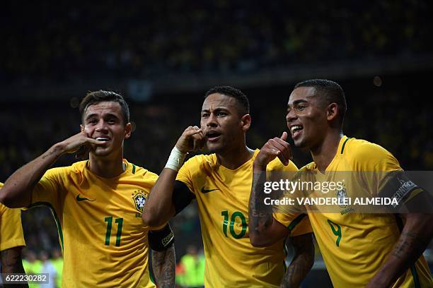 Brazil's Neymar celebrates with teammates Philippe Coutinho and Gabriel Jesus after scoring against Argentina during their 2018 FIFA World Cup...