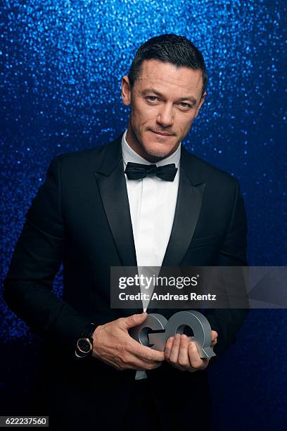 Luke Evans, wearing a Bulgari watch, poses backstage at the GQ Men of the year Award 2016 at Komische Oper on November 10, 2016 in Berlin, Germany.