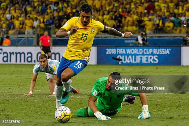 Paulinho of Brazil drives the ball past Sergio Romero goalkeeper of Argentina during a match between Argentina and Brazil as part of FIFA 2018 World...