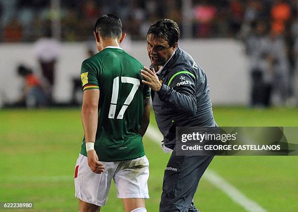 Bolivia's coach Angel Guillermo Hoyos talks to Marvin Bejarano during their WC 2018 qualifier football match against Venezuela, in Maturin,...