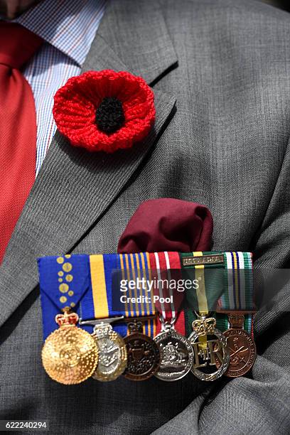 Poppy and medals are seen on the jacket of an ex-serviceman prior to the Remembrance Day service at the Cenotaph on November 11, 2016 in Sydney,...