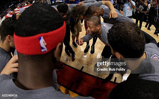 Dwyane Wade of the Chicago Bulls huddles with teammates before the game against the Miami Heat at American Airlines Arena on November 10, 2016 in...