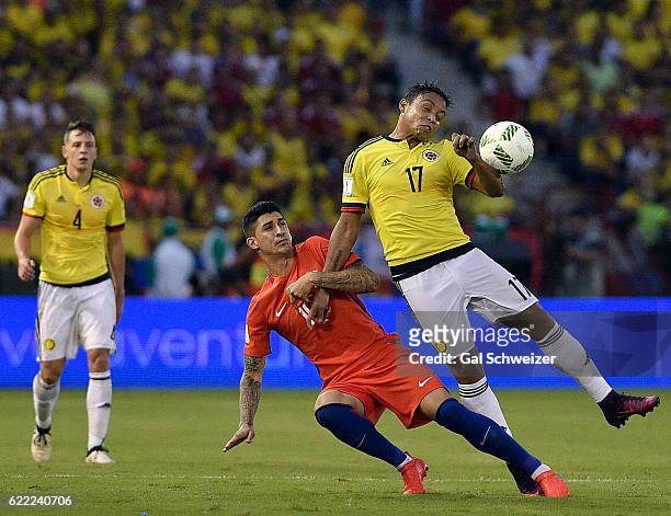 Luis Fernando Muriel of Colombia struggles for the ball with Eduardo Vargas of Chile during a match between Colombia and Chile as part of FIFA 2018...