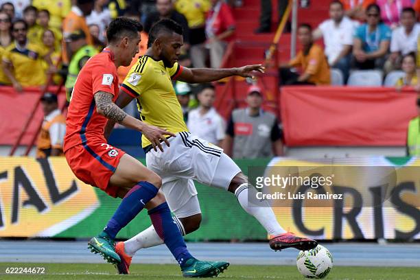 Miguel Borja of Colombia fights for the ball with Enzo Roco of Chile during a match between Colombia and Chile as part of FIFA 2018 World Cup...
