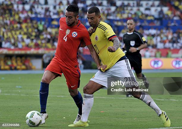Mauricio Isla of Chile fights for the ball with Edwin Cardona of Colombia during a match between Colombia and Chile as part of FIFA 2018 World Cup...