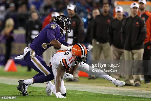 Wide receiver Terrelle Pryor of the Cleveland Browns is tackled by cornerback Jimmy Smith of the Baltimore Ravens in the second quarter at M&T Bank...