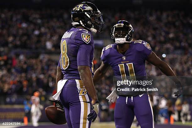 Wide receiver Breshad Perriman of the Baltimore Ravens celebrates with teammate wide receiver Kamar Aiken after scoring a fourth quarter touchdown...