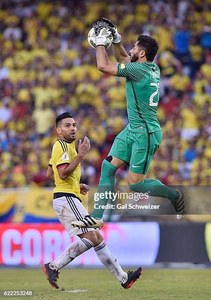 Falcao of Colombia struggles for the ball with goalkeeper Johnny Rivera of Chile during a match between Colombia and Chile as part of FIFA 2018 World...