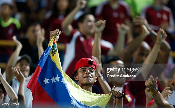 Fans of Venezuela cheer for their team during a match between Venezuela and Bolivia as part of FIFA 2018 World Cup Qualifiers at Monumental de...