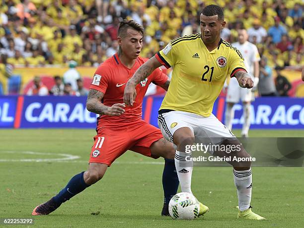 Edwin Cardona of Colombia struggles for the ball with Eduardo Vargas of Chile during a match between Colombia and Chile as part of FIFA 2018 World...