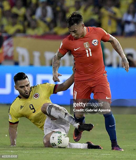 Radamel Falcao of Colombia struggles for the ball with Eduardo Vargas of Chile during a match between Colombia and Chile as part of FIFA 2018 World...