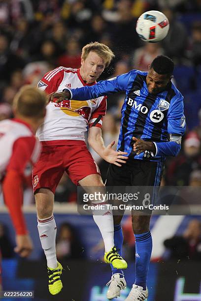 November 06: Dax McCarty of New York Red Bulls and Patrice Bernier of Montreal Impact challenge for the ball during the New York Red Bulls Vs...