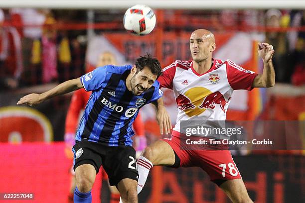 November 06: Matteo Mancosu of Montreal Impact is challenged by Aurelien Collin of New York Red Bulls during the New York Red Bulls Vs Montreal...